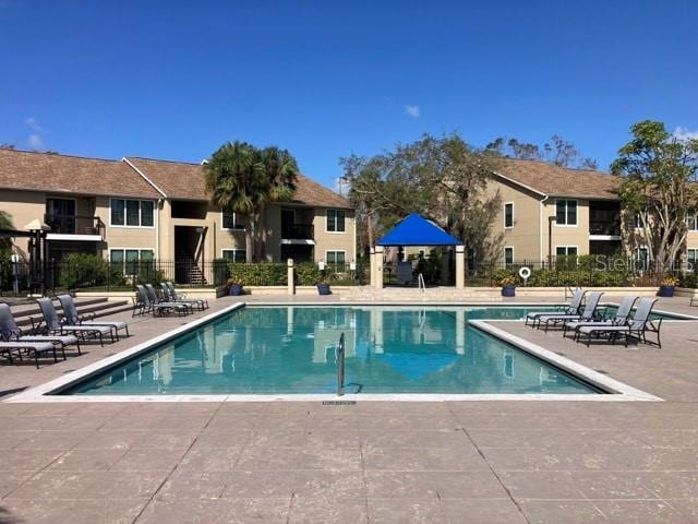 community pool with a patio