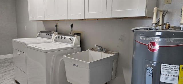 laundry room featuring marble finish floor, washer and clothes dryer, cabinet space, electric water heater, and a sink