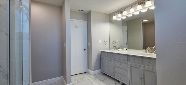 full bath featuring marble finish floor, double vanity, visible vents, a sink, and baseboards