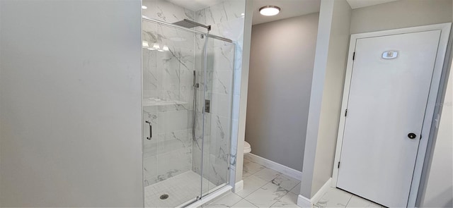 full bathroom featuring marble finish floor, a marble finish shower, toilet, and baseboards