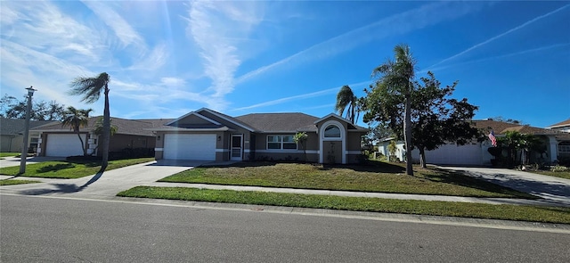 single story home featuring an attached garage, concrete driveway, a front yard, and a residential view