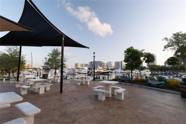 view of patio / terrace with a city view and a boat dock