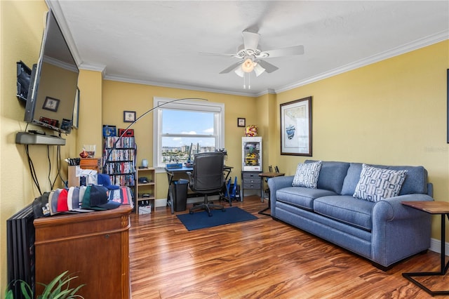 office with a ceiling fan, baseboards, ornamental molding, and wood finished floors