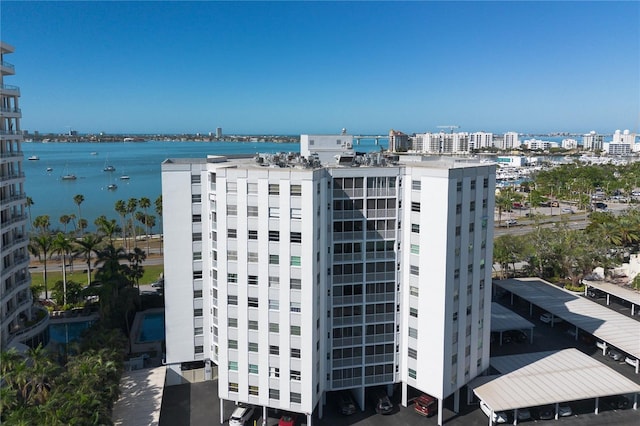 view of property featuring a city view and a water view