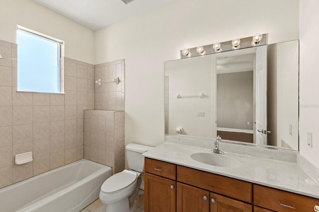 full bathroom featuring toilet,  shower combination, tile patterned flooring, and vanity