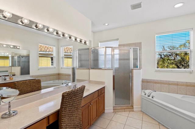 bathroom featuring a garden tub, visible vents, vanity, a shower stall, and tile patterned floors