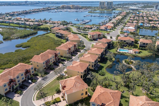 aerial view featuring a residential view and a water view