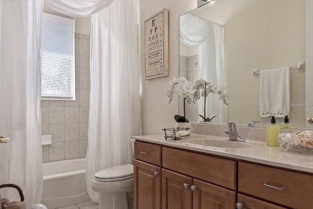 bathroom featuring vanity, tile patterned flooring, shower / bath combo with shower curtain, and toilet