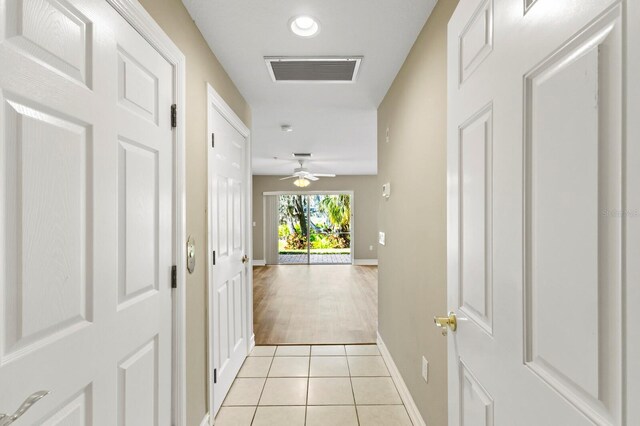 1318 3rd Street Cir E, Palmetto, FL 34221 - corridor with light tile patterned flooring and baseboards