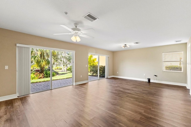 1318 3rd Street Cir E, Palmetto, FL 34221 - unfurnished room featuring wood finished floors and a ceiling fan