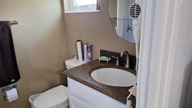 half bath with vanity and toilet