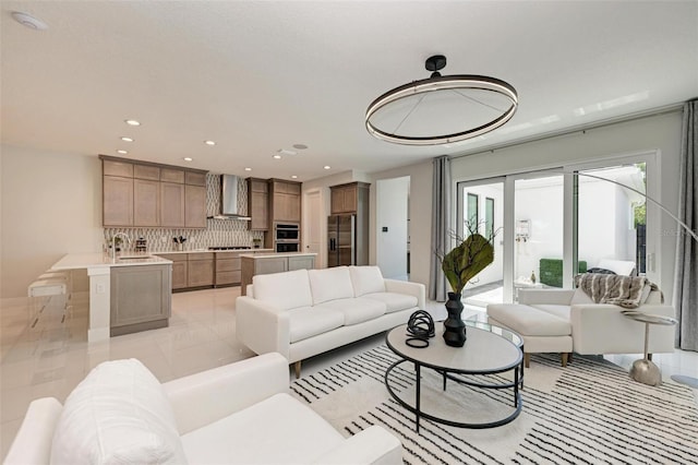 living area featuring light tile patterned floors and recessed lighting