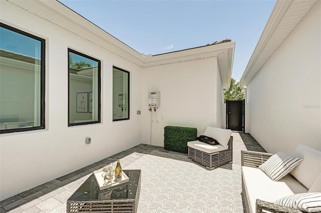 view of patio / terrace featuring an outdoor living space with a fire pit