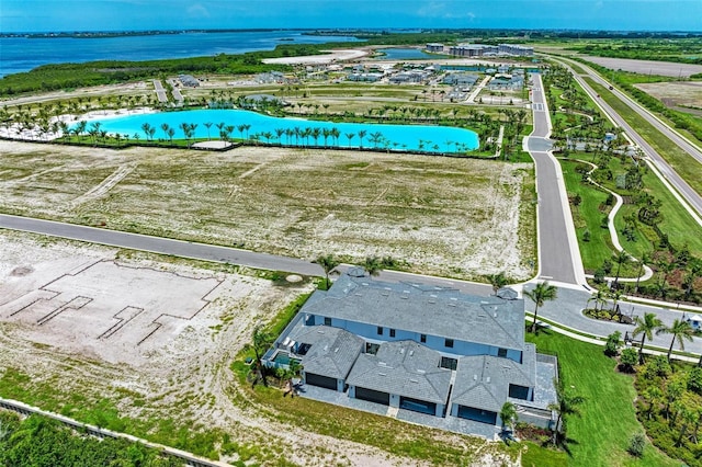 birds eye view of property featuring a water view