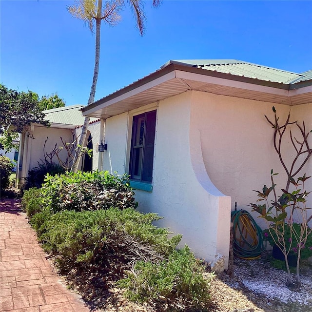 1428 Pine Island Ct, Punta Gorda, FL 33950 - exterior space featuring metal roof and stucco siding