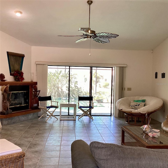 1428 Pine Island Ct, Punta Gorda, FL 33950 - living room featuring a ceiling fan, a glass covered fireplace, plenty of natural light, and light tile patterned floors