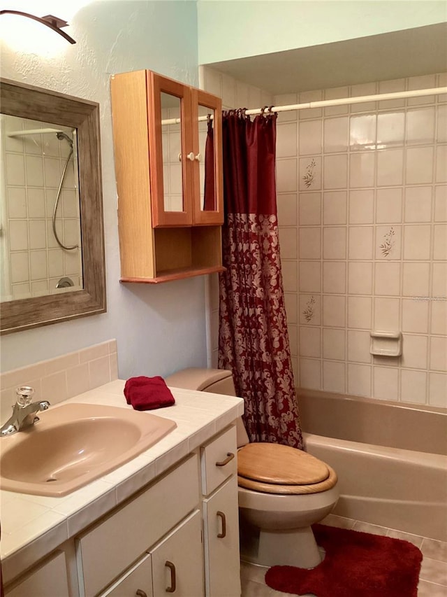 1428 Pine Island Ct, Punta Gorda, FL 33950 - full bathroom featuring toilet, tile patterned floors, shower / tub combo with curtain, and vanity