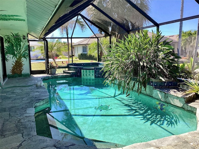 1428 Pine Island Ct, Punta Gorda, FL 33950 - view of swimming pool with a pool with connected hot tub and glass enclosure