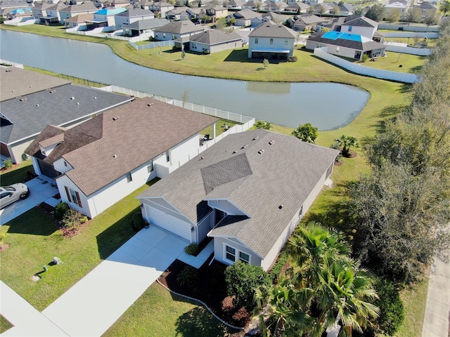 bird's eye view with a residential view and a water view