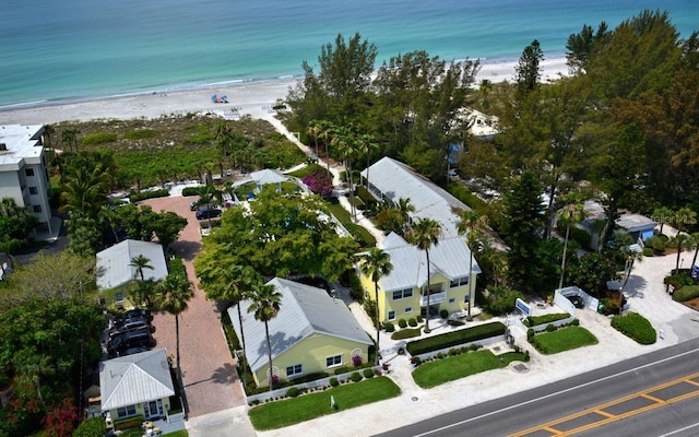 aerial view with a beach view, a residential view, and a water view