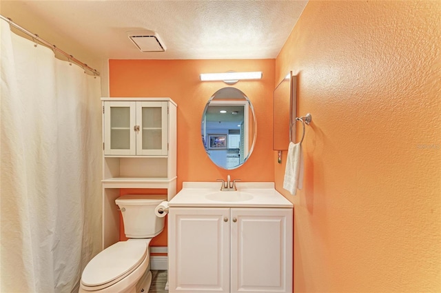 full bathroom with visible vents, a textured wall, toilet, a textured ceiling, and vanity