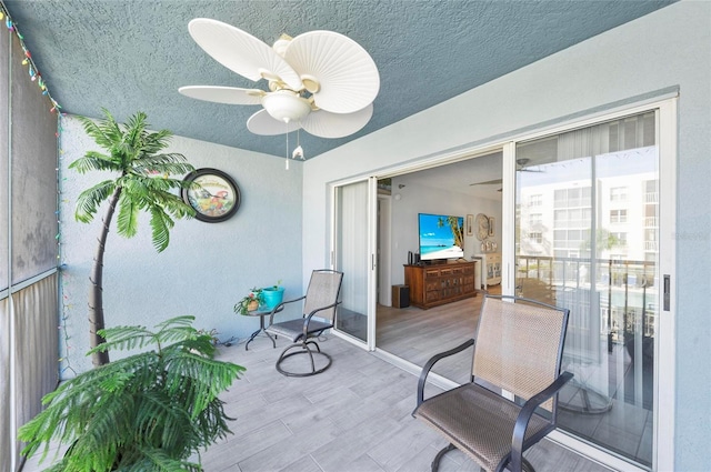 view of patio / terrace featuring ceiling fan