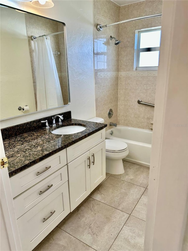 full bath featuring vanity, shower / bath combo with shower curtain, tile patterned flooring, and toilet