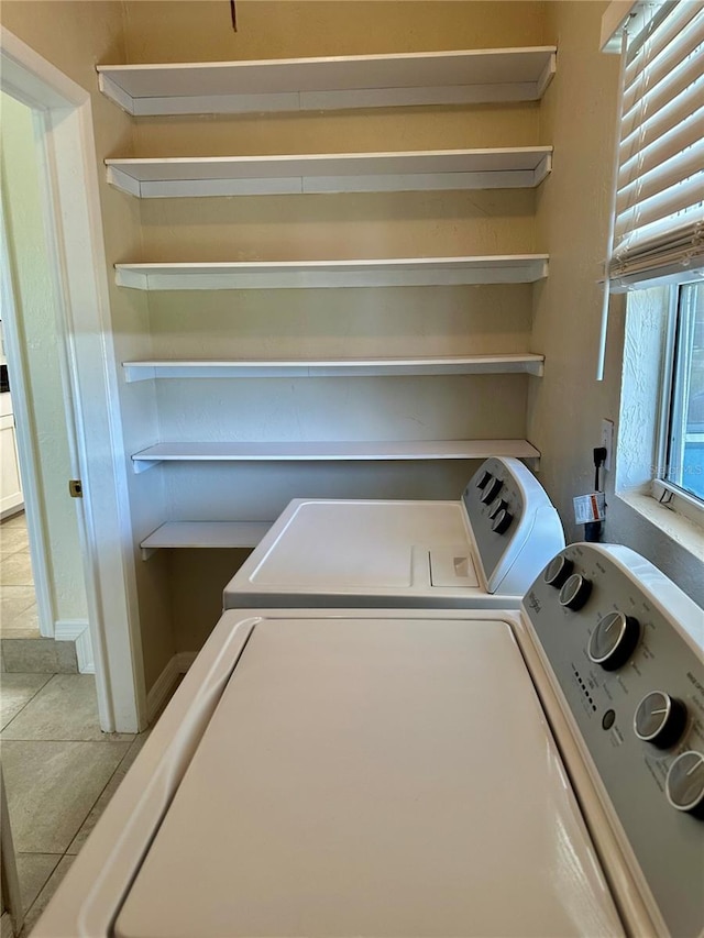 washroom with laundry area and washing machine and clothes dryer