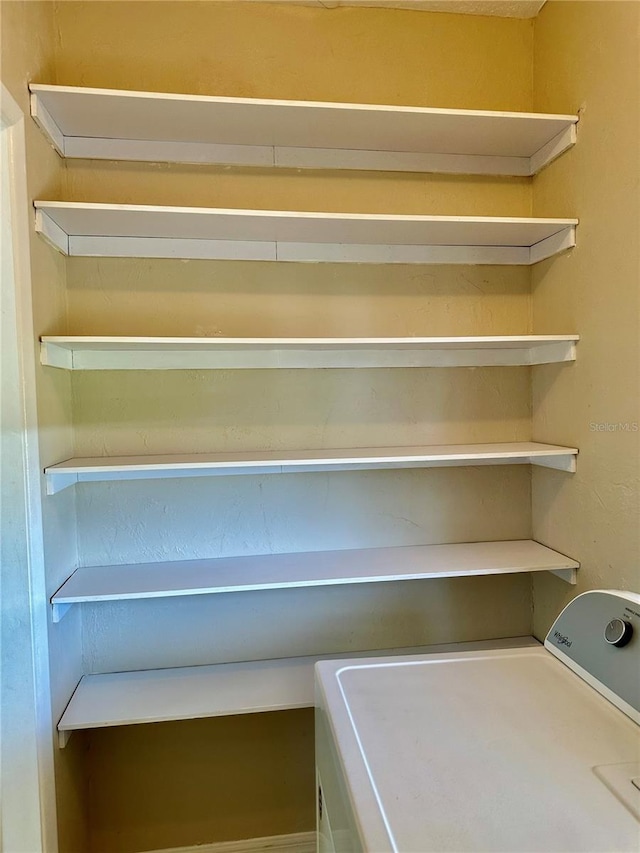 pantry featuring washer / clothes dryer