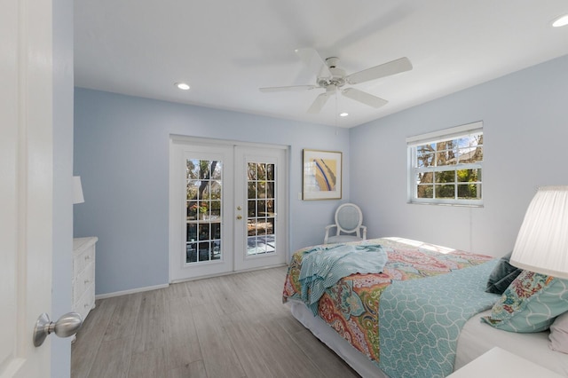 bedroom featuring light wood finished floors, recessed lighting, access to exterior, and french doors