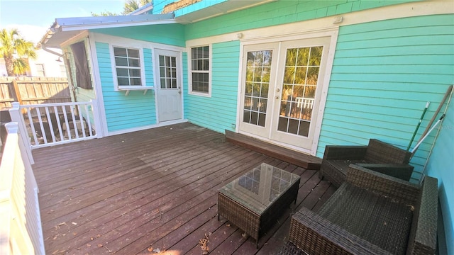 wooden terrace with french doors and fence