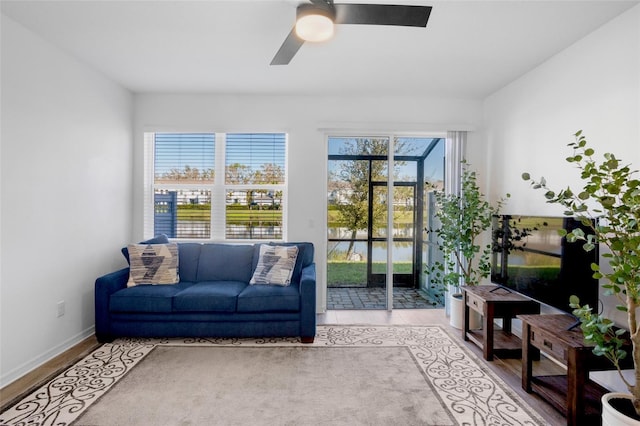 sunroom / solarium with ceiling fan