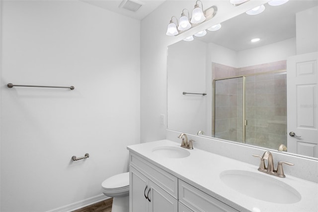 full bathroom featuring double vanity, visible vents, a sink, and tiled shower