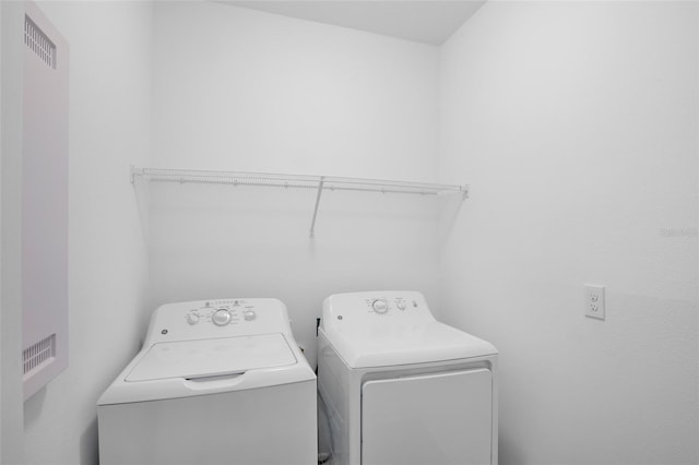 laundry room with laundry area and separate washer and dryer