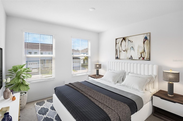 carpeted bedroom with baseboards