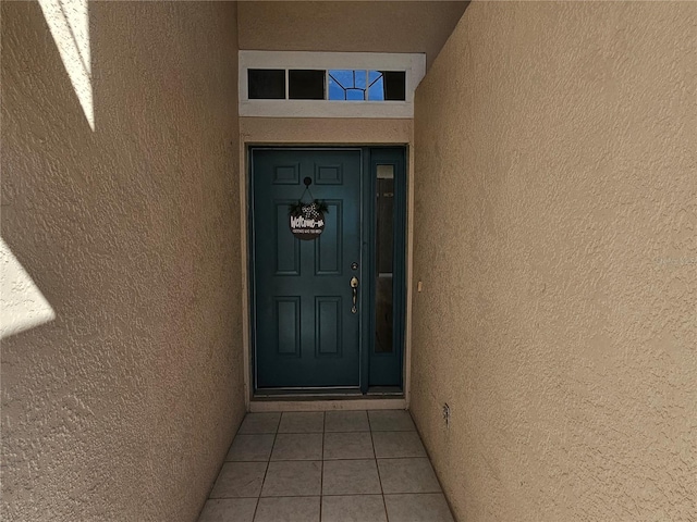 property entrance featuring stucco siding