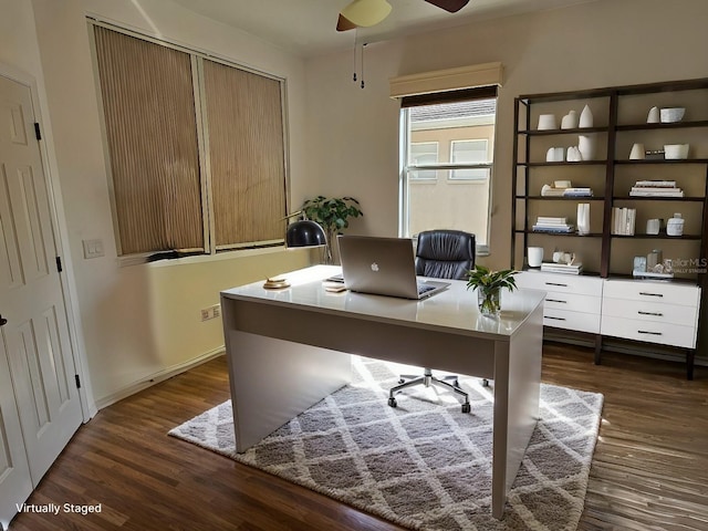 office area featuring baseboards, a ceiling fan, and dark wood-style flooring