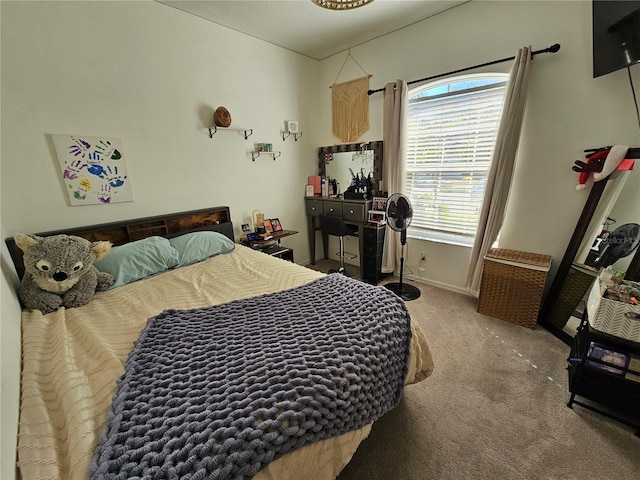 carpeted bedroom with baseboards