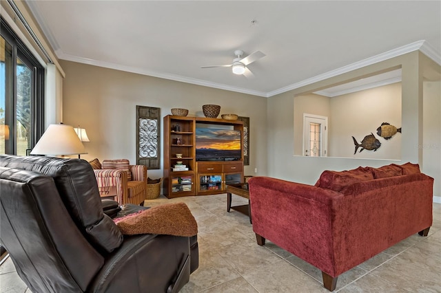 living area featuring ornamental molding, light tile patterned floors, and a ceiling fan