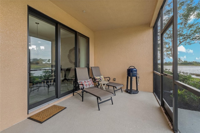 sunroom with a water view