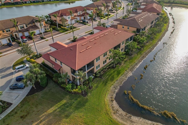 aerial view featuring a residential view and a water view