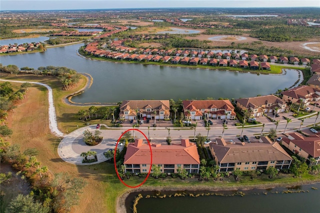 aerial view featuring a water view and a residential view