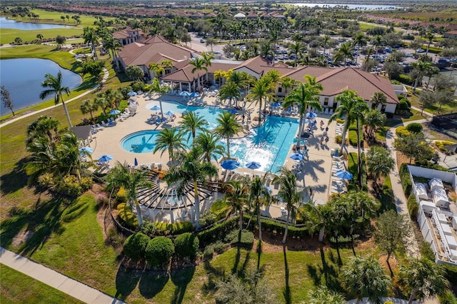 bird's eye view with a water view and a residential view