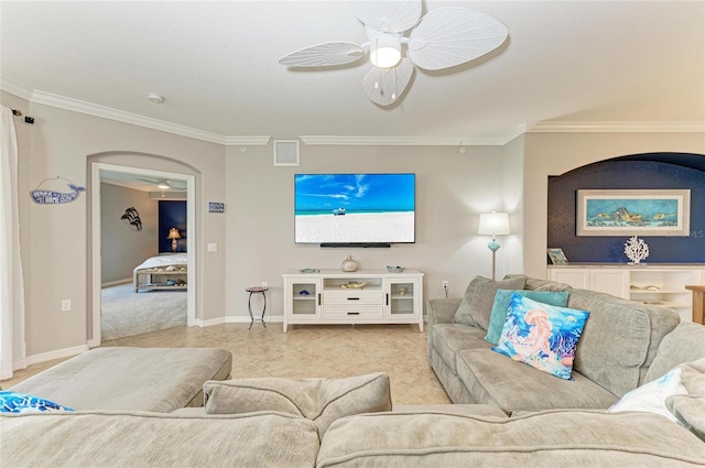 tiled living area with crown molding, visible vents, and a ceiling fan