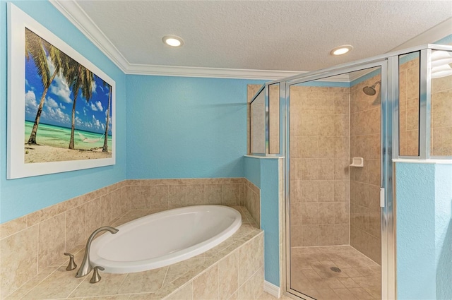 bathroom featuring a stall shower, ornamental molding, a textured ceiling, a bath, and recessed lighting