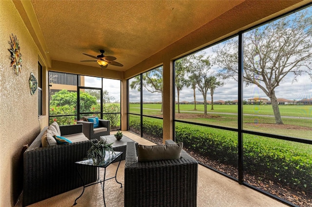 sunroom with a ceiling fan