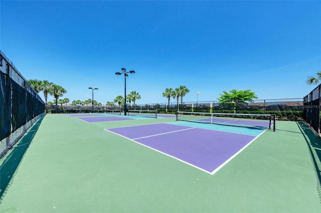 view of sport court with fence