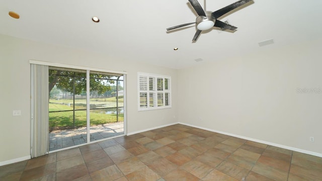 spare room with a ceiling fan, recessed lighting, and baseboards