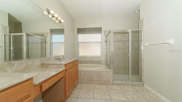 full bathroom with tile patterned flooring, a garden tub, vanity, and a shower stall