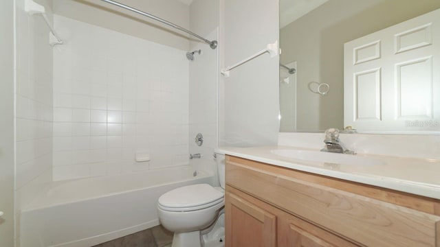 bathroom featuring toilet, shower / bath combination, and vanity